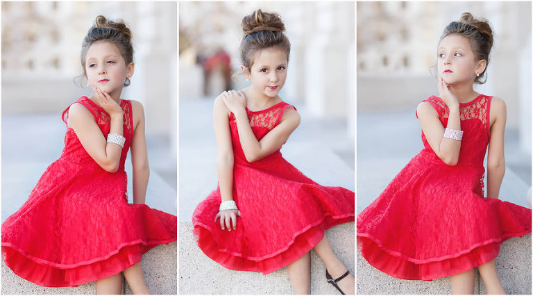 beautiful little girl in red dress posing for pictures in san francisco
