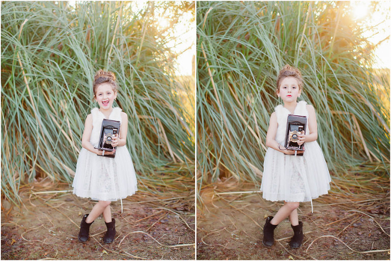 little girl in white dress holding vintage camera