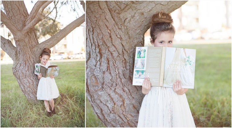 little girl in white dress holding Style Me Pretty Weddings book