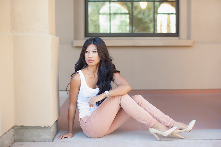 gorgeous asian model sitting on ground looking away from camera in marin