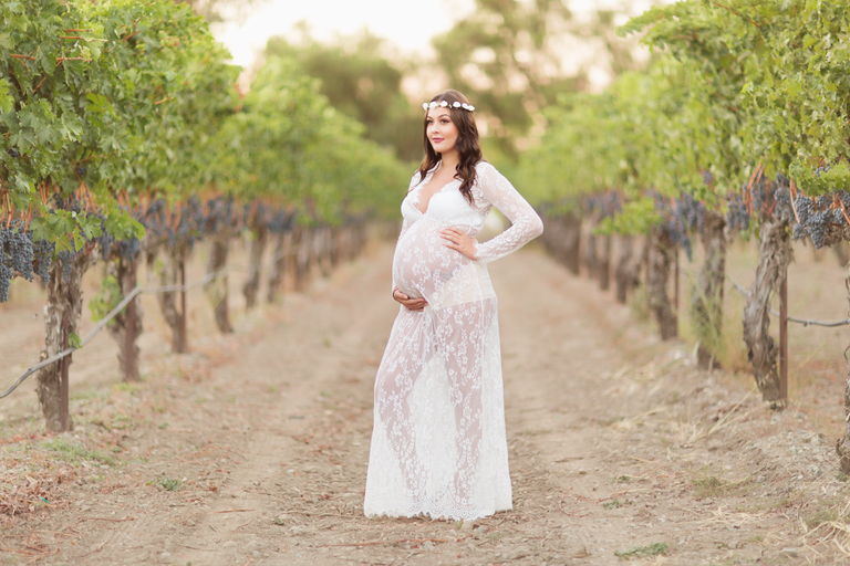 goddess looking expecting mother in see through lace gown and flower crown livermore winery