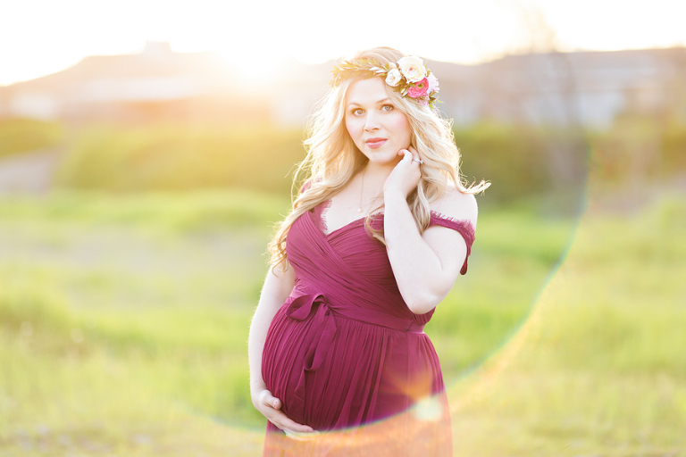 sunfare maternity picture of pregnant mom in maroon dress with flower crown in livermore field