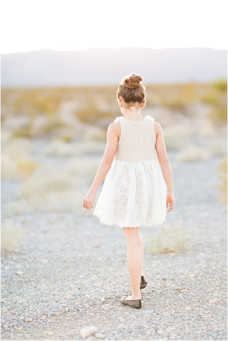 child walking away from the camera with beautiful las vegas light all ariound her livermore child photographer