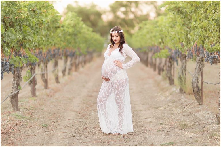 maternity portrait in see through long white lace dress
