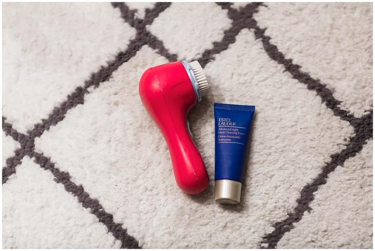Red Clarisonic paired with Estee Lauder Cleanser