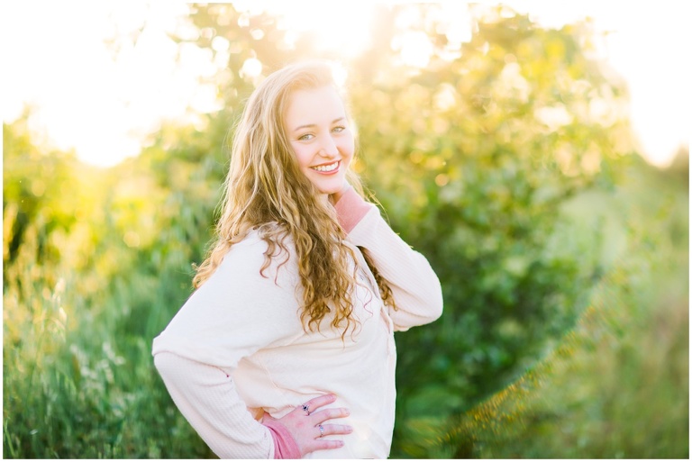 teenager posing with beautiful sunlight wrapped around her