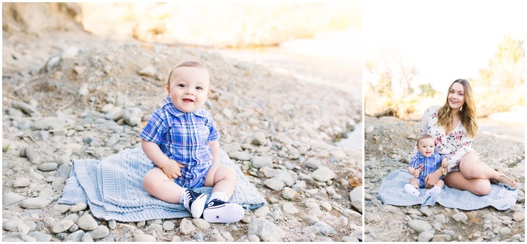 baby smiling sitting on rock bed next to river in Brentwood