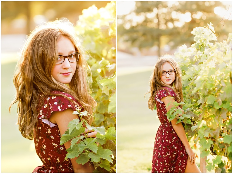 teen in long maroon dress next to grapevines